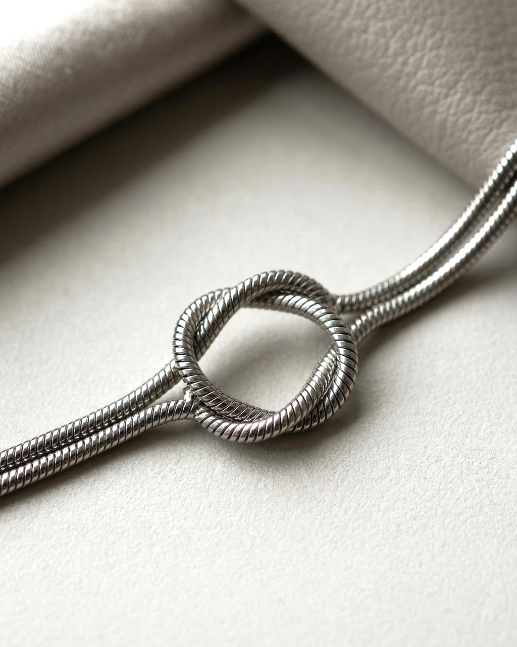 Elegant Silver Toned Minimalist Interlocking Knot Snake Chain Bracelet for Women - MVKMBRSR169