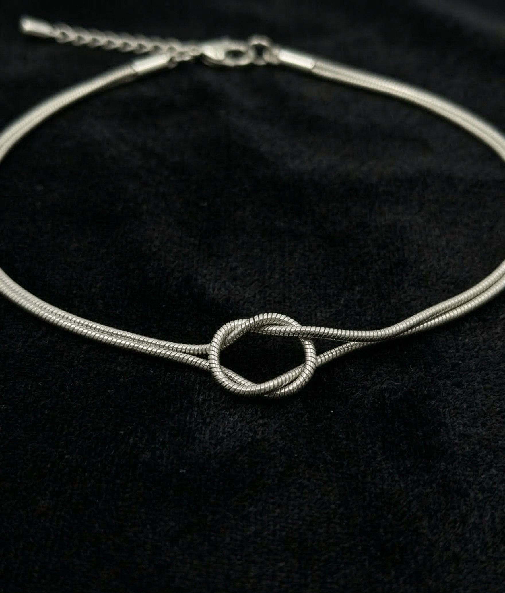 Elegant Silver Toned Minimalist Interlocking Knot Snake Chain Bracelet for Women - MVKMBRSR169